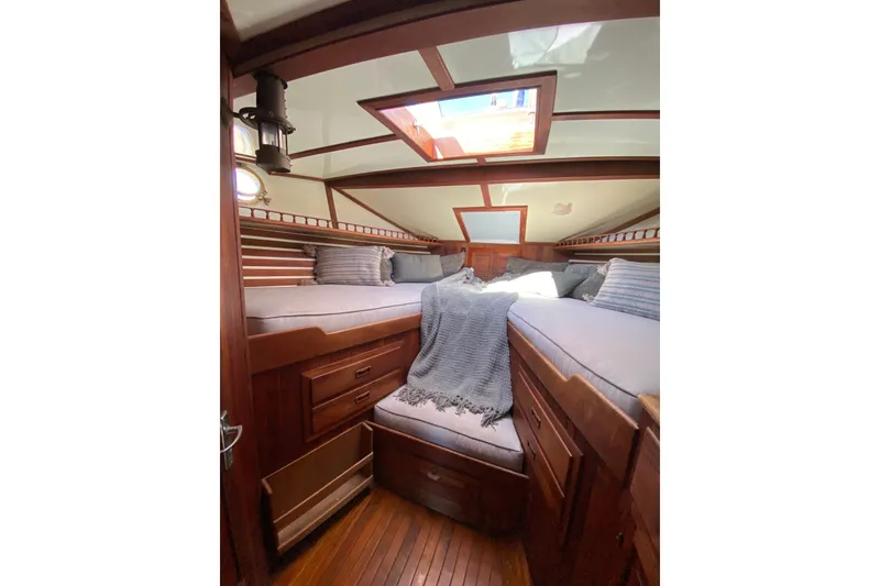 Slide: The Image of Cozy 1976 CT 48 yacht cabin with wooden interior and skylight. - 23