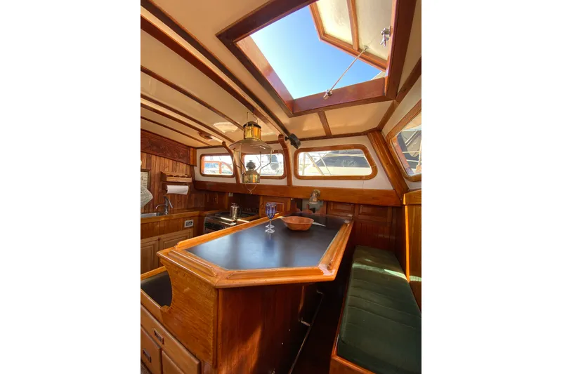 Slide: The Image of Vintage 1976 CT 48 yacht interior with wooden finishes and skylight. - 21