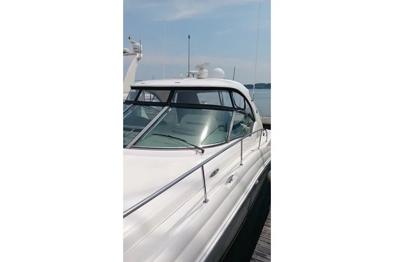 Slide: The Image of 2005 Sea Ray 420 Sundancer yacht docked, showcasing sleek design and luxurious features. - 7
