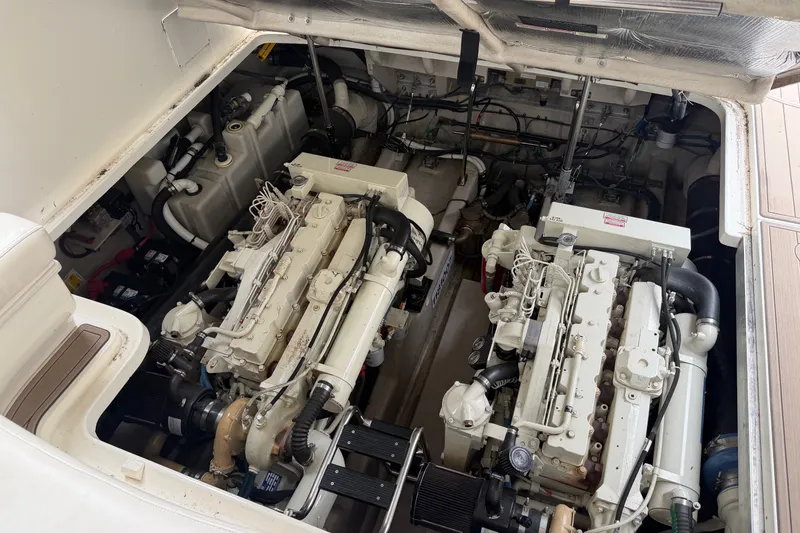 Slide: The Image of Engine compartment of a 2005 Sea Ray 420 Sundancer, showcasing dual marine engines. - 15