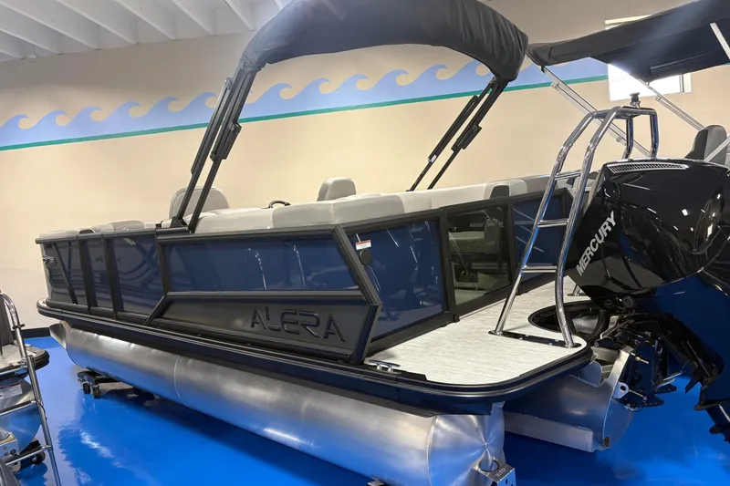 The Image of 2026 Alera A22Q pontoon boat with Mercury engine in showroom. - 0