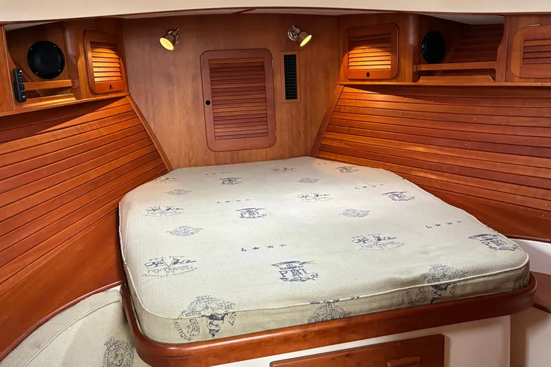 Slide: The Image of Cozy cabin interior of 2014 Hinckley Picnic Boat 37 MKIII with wooden paneling and mattress. - 41