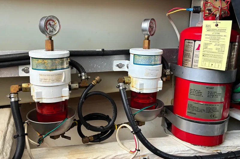 Slide: The Image of Engine room of 2014 Hinckley Picnic Boat 37 MKIII with fuel filters and fire extinguisher. - 50