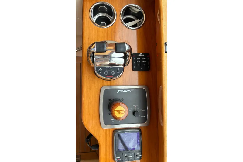 Slide: The Image of Control panel of a 2014 Hinckley Picnic Boat 37 MKIII with navigation instruments. - 22