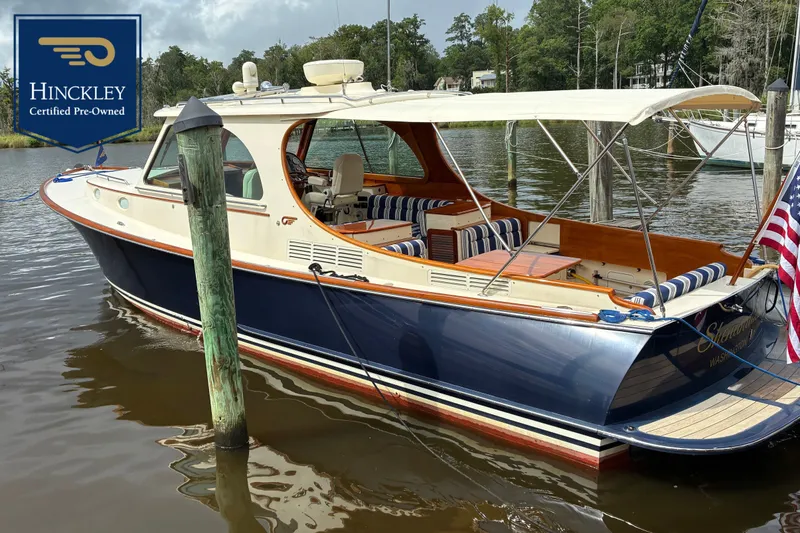 The Image of 2014 Hinckley Picnic Boat 37 MKIII docked with sunshade and striped cushions. - 0