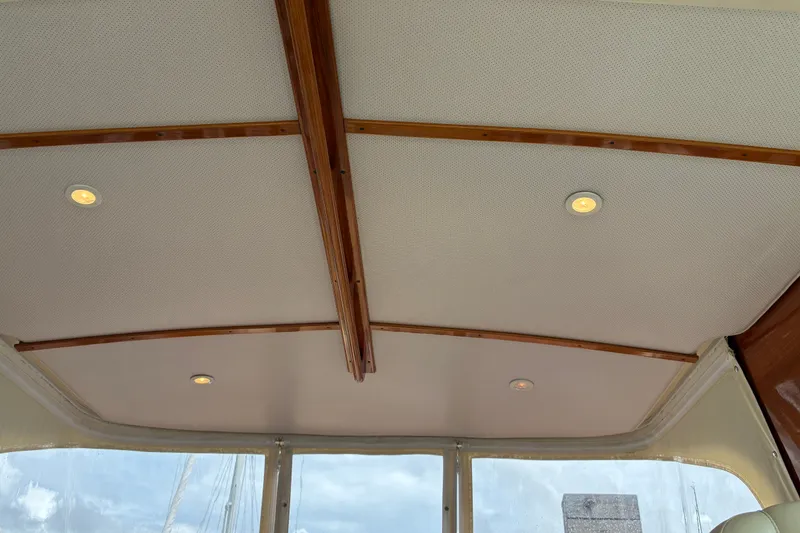 Slide: The Image of Interior ceiling of 2014 Hinckley Picnic Boat 37 MKIII with wooden beams and recessed lighting. - 20