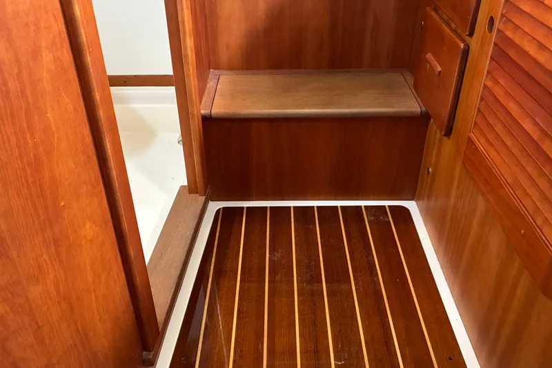 Slide: The Image of 2014 Hinckley Picnic Boat 37 MKIII interior with wooden flooring and seating. - 29