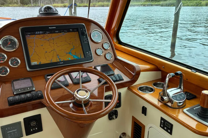 Slide: The Image of Helm of 2014 Hinckley Picnic Boat 37 MKIII with navigation system and controls. - 21