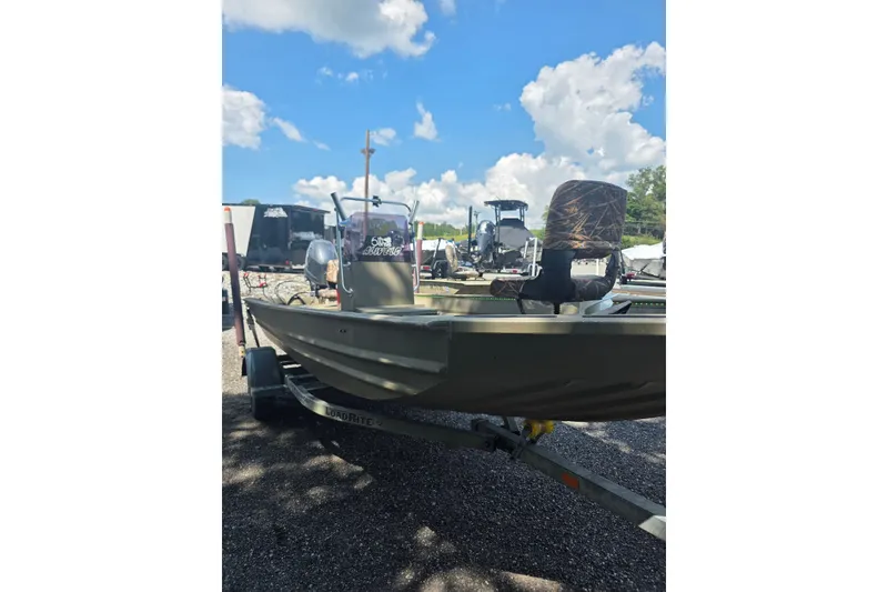 Slide: The Image of 2017 Alweld 1756VCC Angler boat on trailer under blue sky. - 13