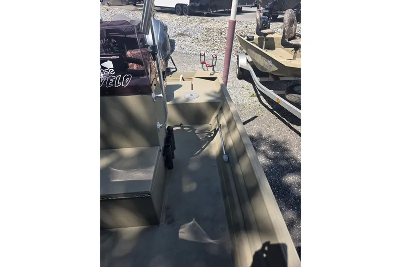 Slide: The Image of 2017 Alweld 1756VCC Angler boat interior with seating and fishing rod holders. - 8