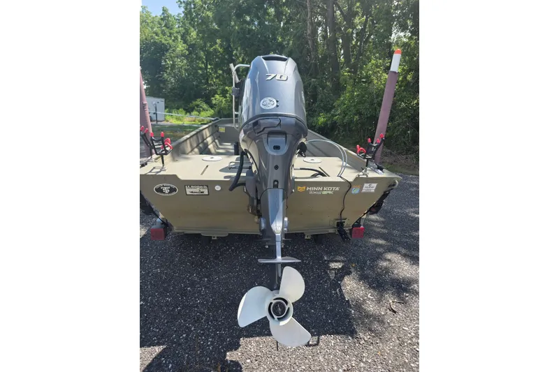 Slide: The Image of 2017 Alweld 1756VCC Angler boat with outboard motor, parked on gravel. - 5
