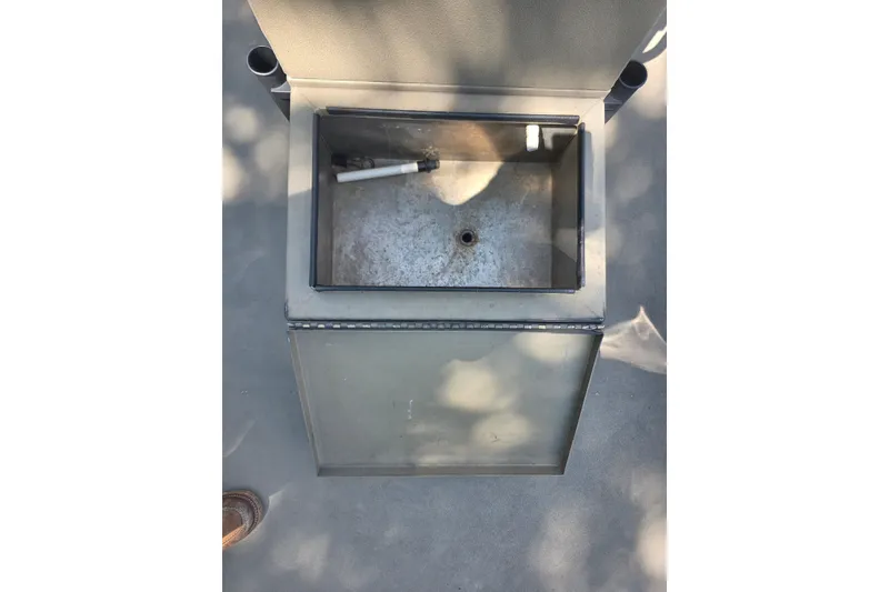 Slide: The Image of Open storage compartment of 2017 Alweld 1756VCC Angler boat, showing interior details. - 11