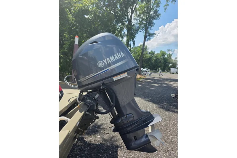 Slide: The Image of 2017 Alweld 1756VCC Angler with Yamaha outboard motor in a sunny outdoor setting. - 4