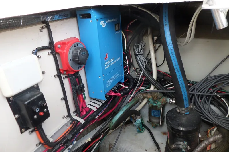 Slide: The Image of Electrical system of a 1997 Mainship 350 Trawler, featuring a Victron Energy battery charger. - 63