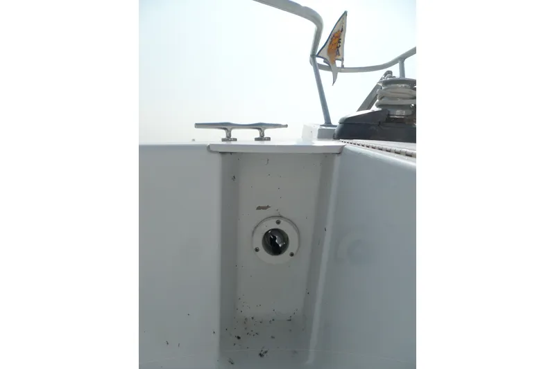 Slide: The Image of 1997 Mainship 350 Trawler deck detail with cleat and winch. - 58