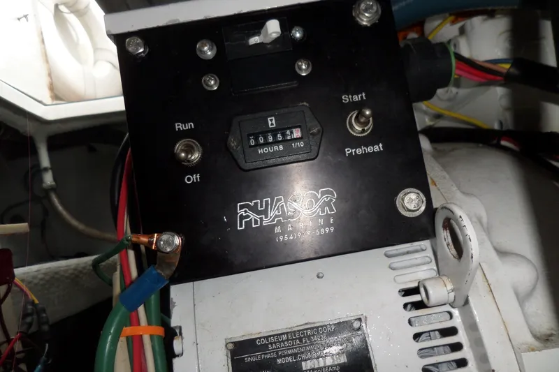 Slide: The Image of Control panel of a 1997 Mainship 350 Trawler engine with hour meter and switches. - 69