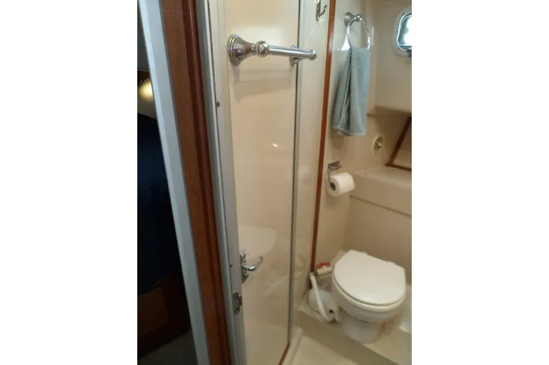 Slide: The Image of Bathroom interior of 1997 Mainship 350 Trawler with shower and toilet. - 29