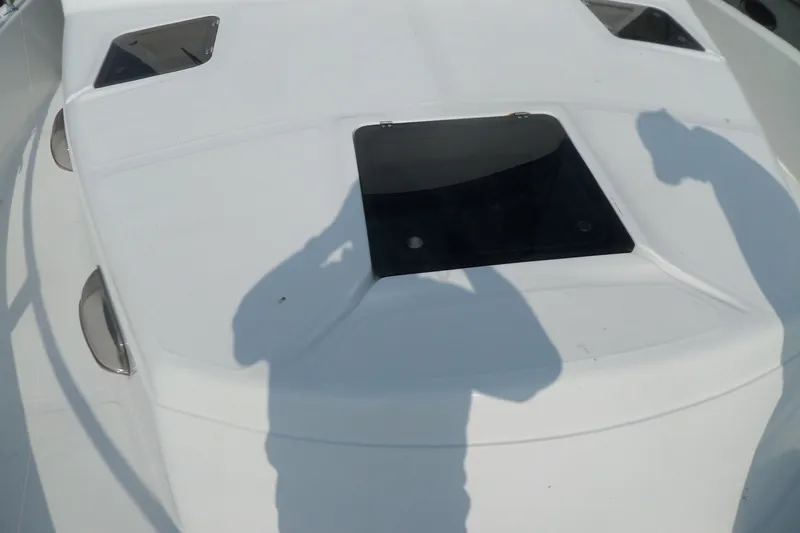 Slide: The Image of 1997 Mainship 350 Trawler deck with hatch and shadows. - 56