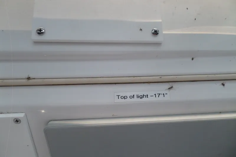 Slide: The Image of Close-up of Mainship 350 Trawler 1997 with label "Top of light - 17'1". - 86