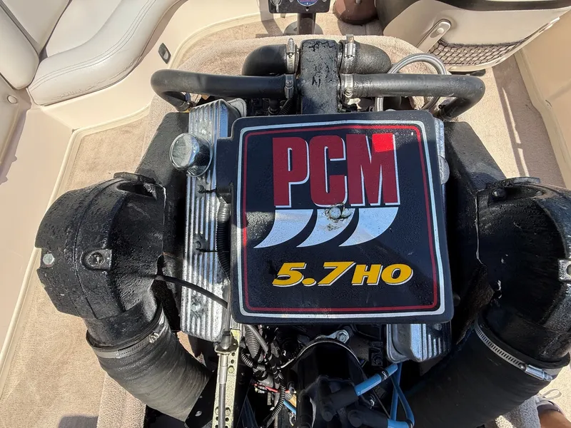 Slide: The Image of A PCM 5.7 HO engine in a boat, surrounded by beige carpeting. - 17