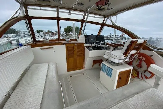 Slide: The Image of Interior of a 1997 Fortier 33 boat with seating and navigation equipment. - 12