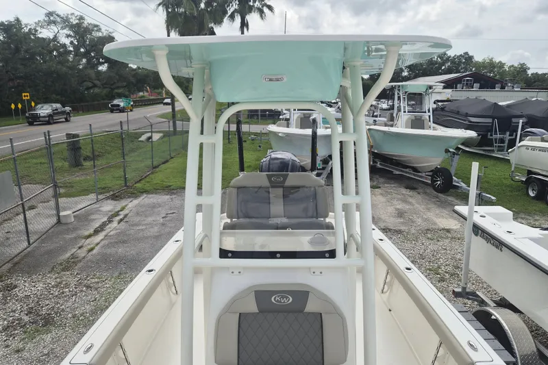 Slide: The Image of 2026 Key West 230 Bay Reef boat displayed in a marina setting. - 26