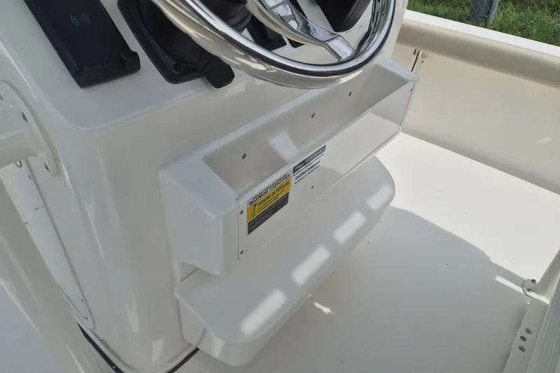 Slide: The Image of Steering console of 2026 Key West 230 Bay Reef boat, featuring a sleek design. - 14