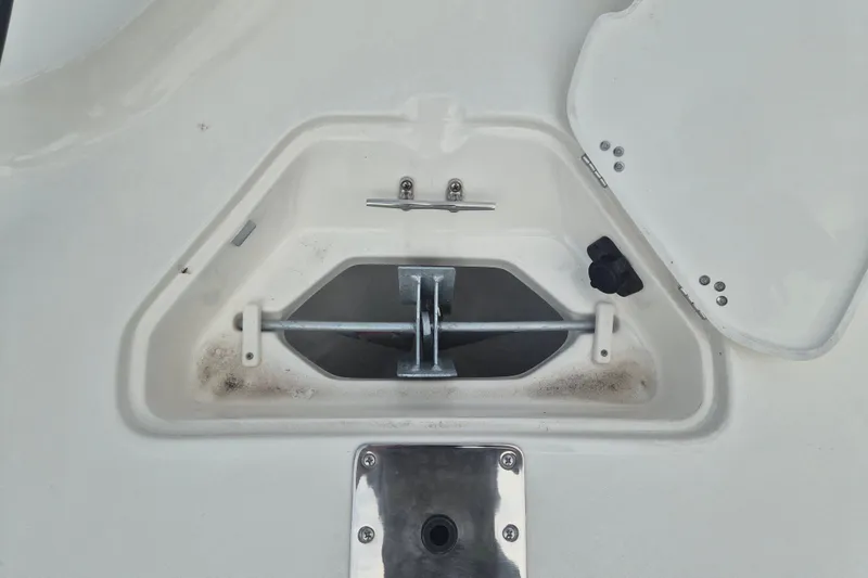Slide: The Image of Anchor compartment of 2026 Key West 230 Bay Reef boat, featuring a clean, white design. - 22