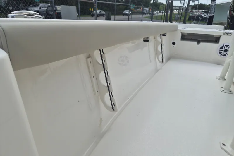 Slide: The Image of 2026 Key West 230 Bay Reef boat interior with rod holders and seating. - 27
