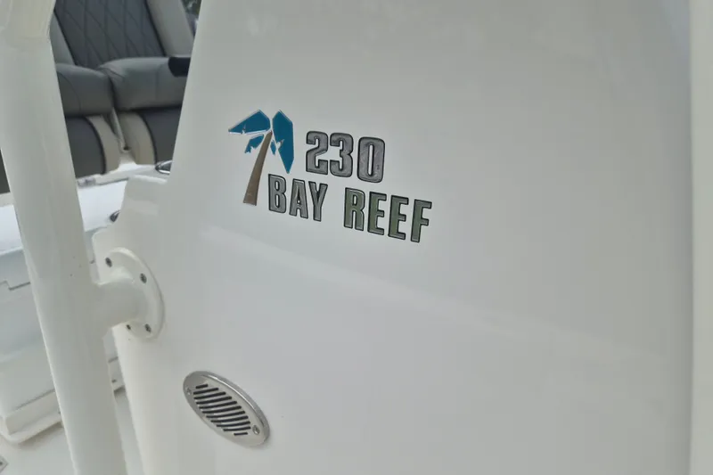 Slide: The Image of 2026 Key West 230 Bay Reef boat interior with logo detail. - 28