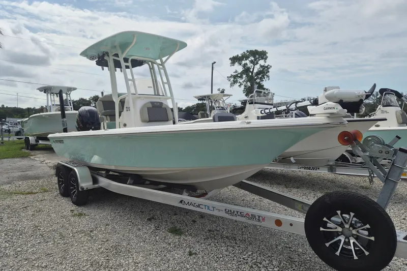 The Image of 2026 Key West 230 Bay Reef boat on trailer, displayed outdoors. - 1