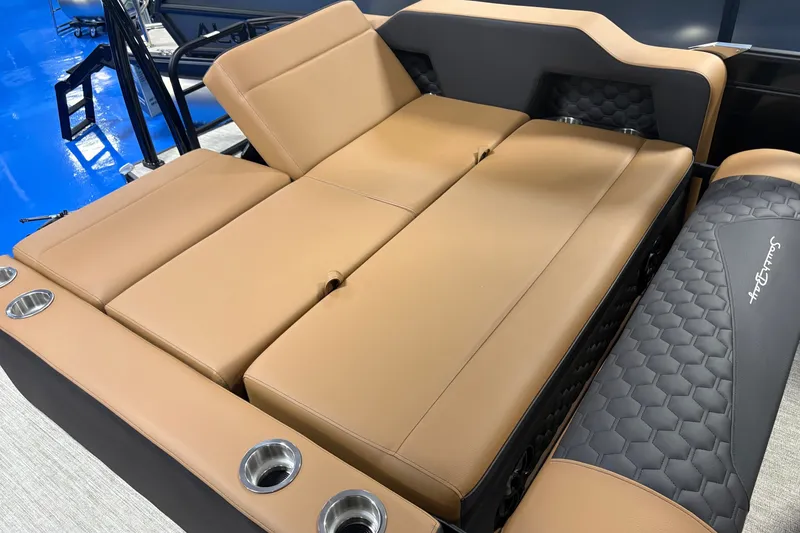 Slide: The Image of Luxurious tan seating on 2027 South Bay 525UL boat with cup holders and stylish design. - 9