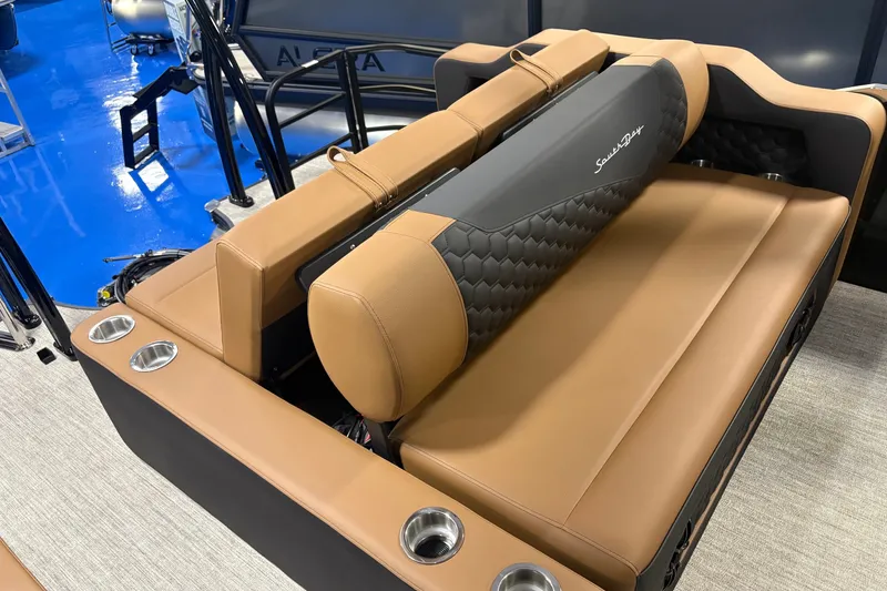 Slide: The Image of Luxurious seating on 2027 South Bay 525UL boat with tan upholstery and cup holders. - 11