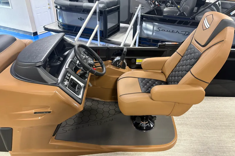 Slide: The Image of Luxurious 2027 South Bay 525UL boat interior with premium captain's chair and modern dashboard. - 5