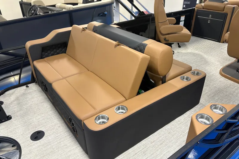 Slide: The Image of Luxurious tan seating on 2027 South Bay 525UL boat with integrated cup holders. - 10
