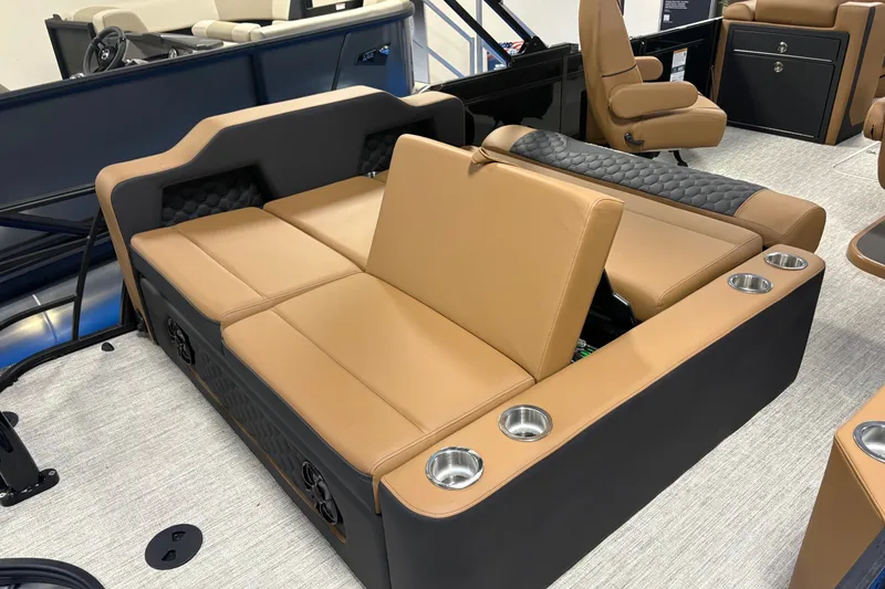 Slide: The Image of Luxurious seating on 2027 South Bay 525UL boat with tan upholstery and cup holders. - 8
