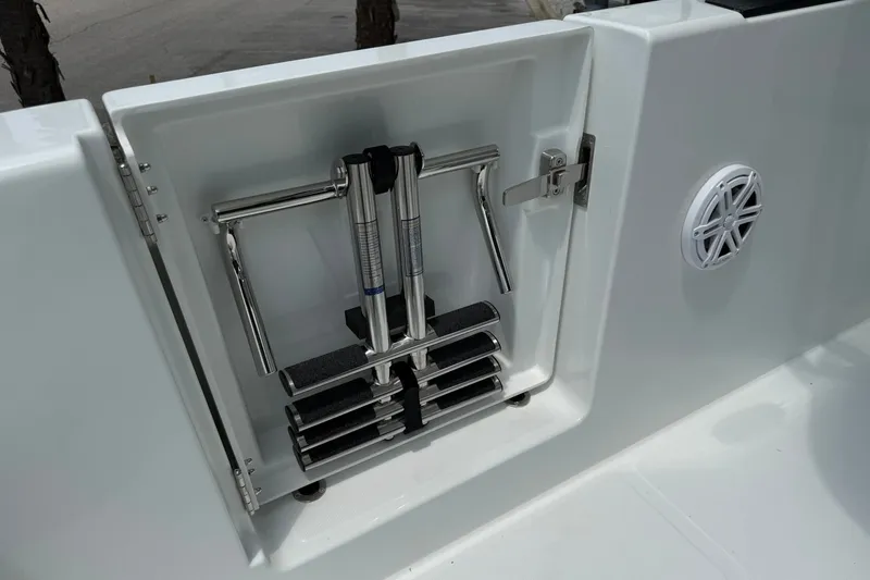 Slide: The Image of A folded swim ladder is installed in a white boat, next to a speaker. - 22