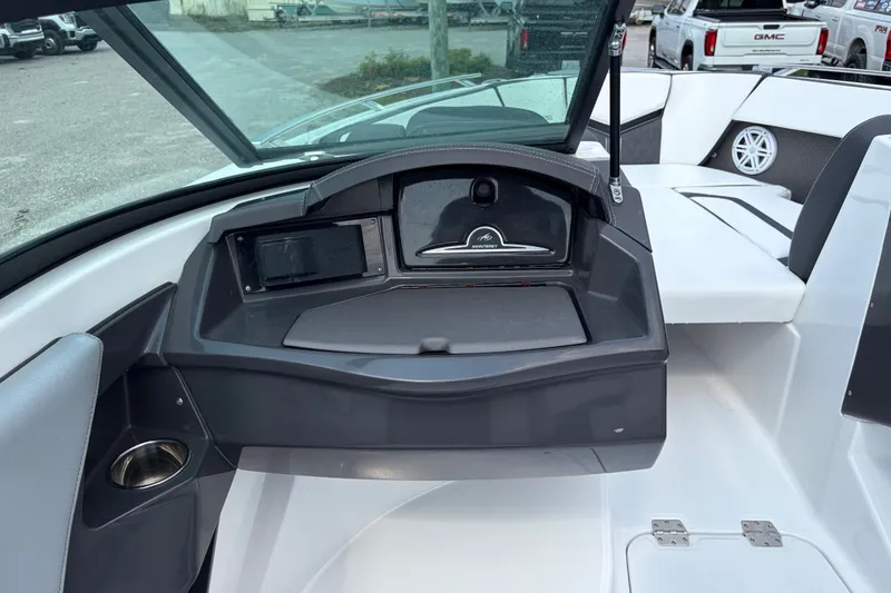 Slide: The Image of 2024 Monterey 215SS Super Sport boat interior with dashboard and seating area. - 18
