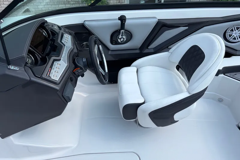 Slide: The Image of 2024 Monterey 215SS Super Sport boat interior with sleek dashboard and comfortable seating. - 15