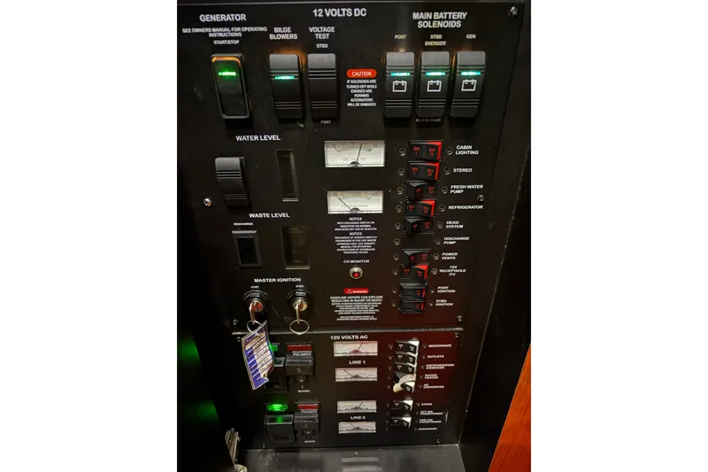 Slide: The Image of Control panel of a 2006 Sea Ray 340 Sundancer boat, showing various switches and indicators. - 32