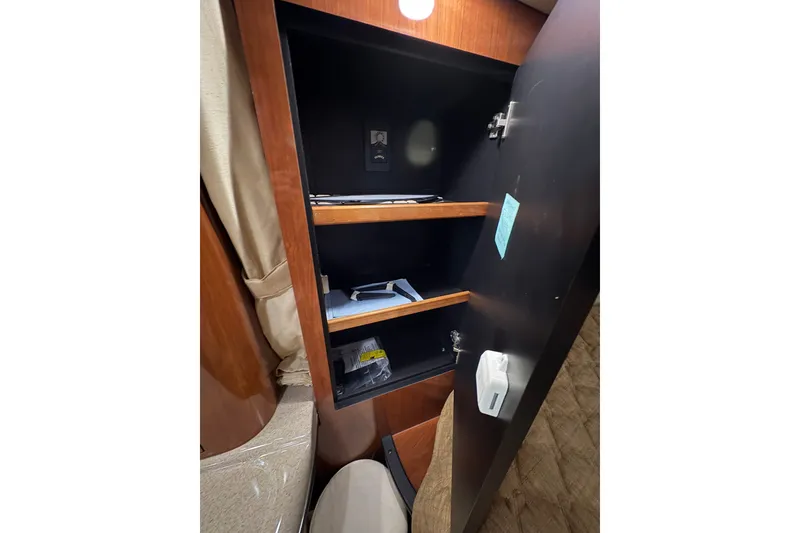 Slide: The Image of Interior storage cabinet on a 2006 Sea Ray 340 Sundancer boat. - 33
