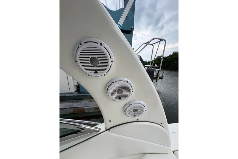 Slide: The Image of Speakers on a 2006 Sea Ray 340 Sundancer boat, docked by the water. - 18