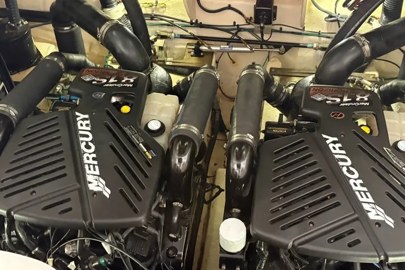 Slide: The Image of Twin Mercury engines in a 2006 Sea Ray 340 Sundancer boat engine room. - 41