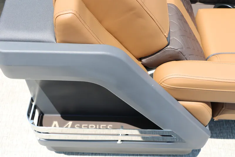 Slide: The Image of 2026 Bennington 22MFB boat seat detail with tan upholstery and sleek design. - 27