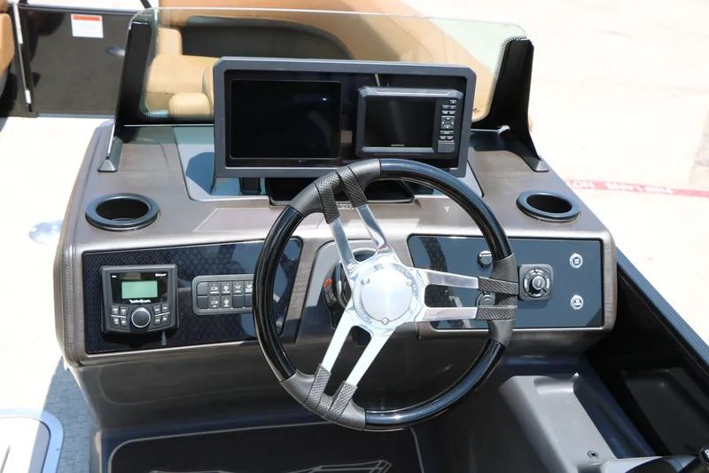 Slide: The Image of Steering console of 2026 Bennington 22MFB boat with modern controls and displays. - 33