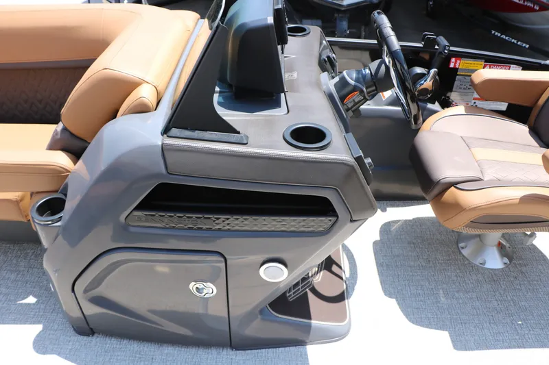 Slide: The Image of 2026 Bennington 22MFB boat interior with steering console and luxurious seating. - 31