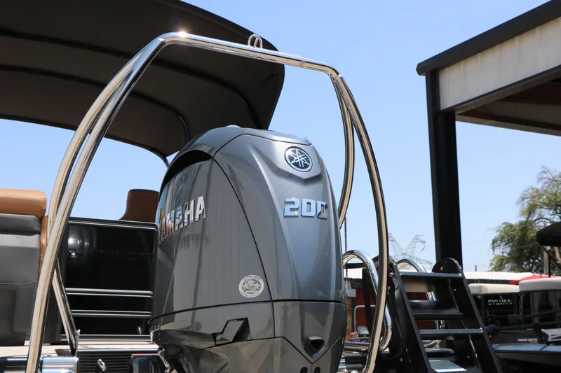 Slide: The Image of 2026 Bennington 22MFB boat with Yamaha 200 engine, sleek design under clear blue sky. - 18