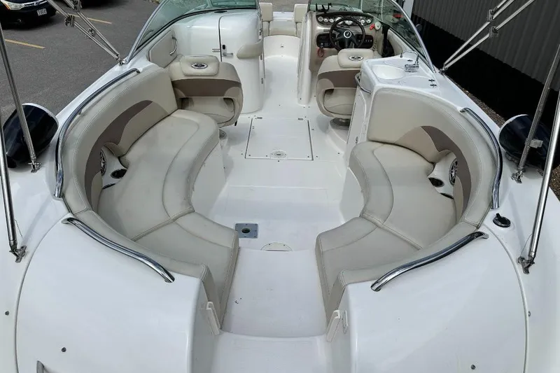 Slide: The Image of 2005 Chaparral Sunesta 274 boat interior with spacious seating and modern dashboard. - 5