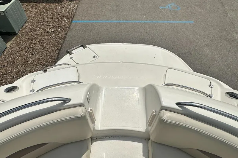 Slide: The Image of 2005 Chaparral Sunesta 274 boat deck with white seating and stainless steel railings. - 15