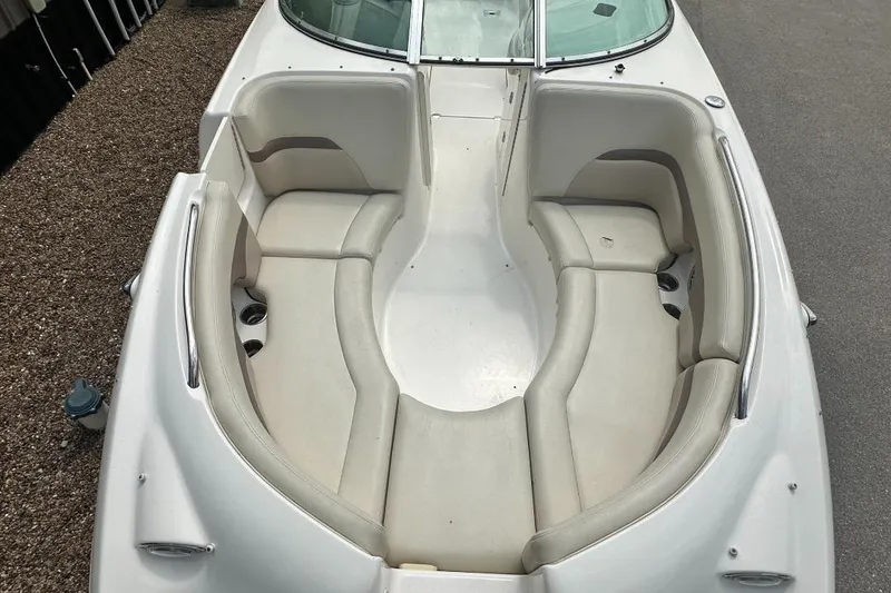 Slide: The Image of 2005 Chaparral Sunesta 274 boat interior with spacious seating and cup holders. - 13